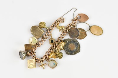 Lot 1208 - A yellow metal curb link bracelet, set with...
