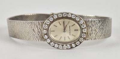 Lot 1612 - BUECHE-GIROD; a lady's 9ct white gold diamond...