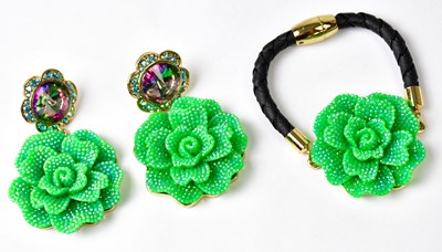 Lot 755 - BUTLER & WILSON; a green crystal-encrusted...