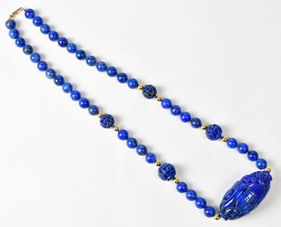 Lot 713 - A lapis lazuli beaded necklace, the central...
