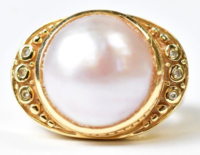 Lot 690 - A 14ct yellow gold ring set with a large pearl...