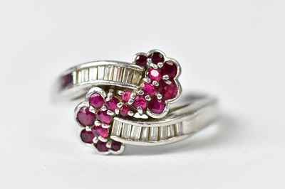 Lot 776 - A platinum ring set with baguette diamonds and...