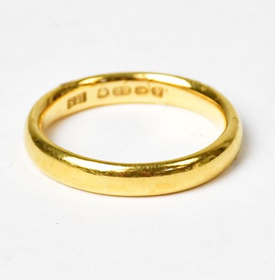 Lot 784 - A 22ct gold wedding band, size L, approx. 4.8g.