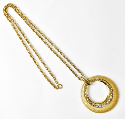Lot 735 - TRIFARI; a large circular gold-coloured...