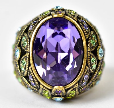 Lot 702 - HEIDI DAUS; a gold-coloured ring set with a...