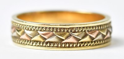 Lot 692 - A 14ct yellow gold ring with yellow, white and...