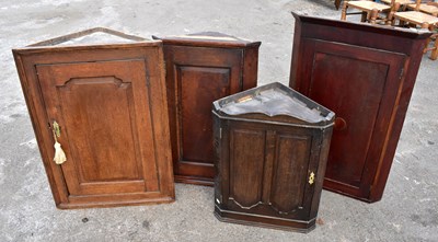 Lot 1689 - Four Georgian and later straight front corner cupboards