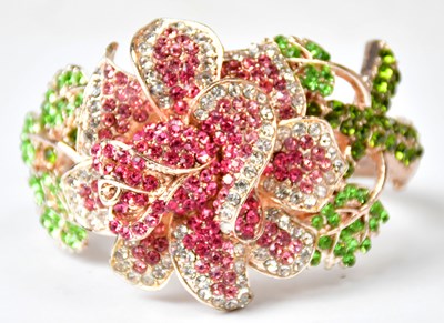Lot 751 - A gold-coloured hinged bracelet in the form of...