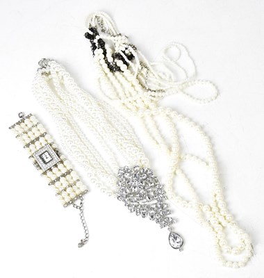 Lot 732 - A five-strand faux pearl necklace set with a...