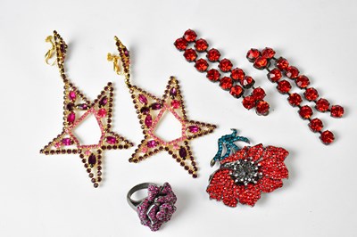 Lot 745 - A pair of star-shaped drop earrings set with...