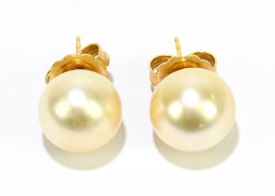 Lot 1491 - A pair of pearl earrings with yellow metal...