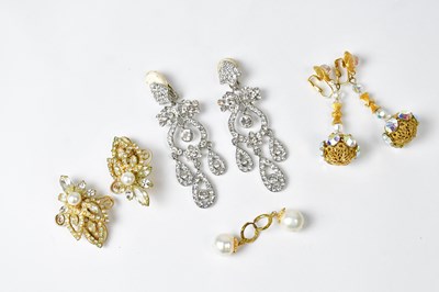Lot 744 - A pair of silver-coloured scroll diamanté clip-...