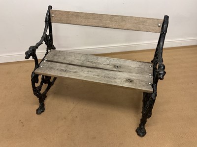 Lot 851 - COALBROOKDALE; a cast iron garden bench...