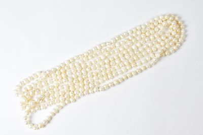 Lot 719 - A long single-strand continuous pearl necklace,...