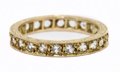 Lot 1056 - A 9ct yellow gold and white stone set full...