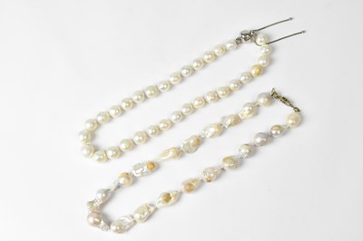 Lot 724 - Two single-strand pearl necklaces, each with...