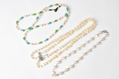 Lot 726 - A two-strand pearl necklace with clear seed...