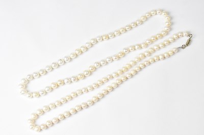 Lot 721 - Four single-strand pearl necklaces, three with...