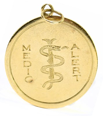 Lot 1361 - A 9ct yellow gold Medic Alert pendant with...