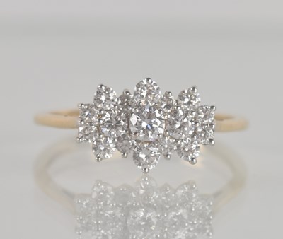 Lot 1258 - A 9ct yellow gold diamond set cluster ring,...