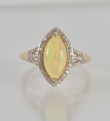 Lot 1259 - A 9ct yellow gold opal and diamond set lozenge...