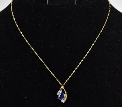 Lot 1395 - A 9ct yellow gold sapphire and diamond set...