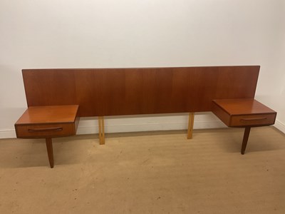 Lot 877 - G PLAN; a Fresco teak double headboard with...
