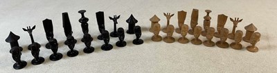 Lot 65 - An African carved and stained wooden figural...