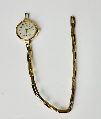 Lot 816 - A lady's 9ct gold wristwatch with Arabic...