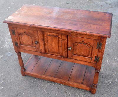 Lot 1737 - A reproduction oak credence cupboard