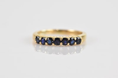Lot 2465 - A yellow metal seven stone dress ring, set...