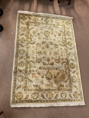 Lot 2164 - A green ground machined woollen Eastern style...