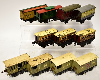 Lot 353 - HORNBY; eleven O gauge tin-plate wagons,...