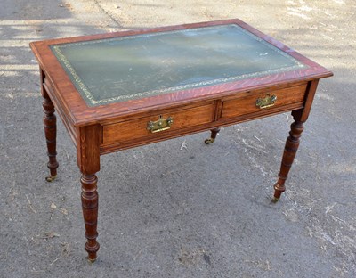 Lot 1699 - An Edwardian oak writing table