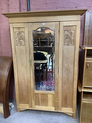 Lot 2119 - An early 20th century oak wardrobe with...