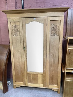 Lot 109 - An early 20th century oak wardrobe with...