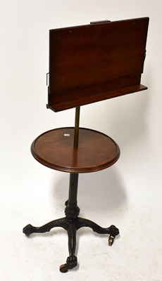Lot 83 - A 19th century mahogany music stand on an...