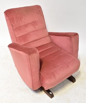 Lot 56 - A 1930s oak rocking chair, upholstered in pink...