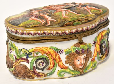 Lot 286 - CAPODIMONTE; a jewellery casket moulded with a...