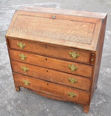 Lot 1695 - A Georgian oak bureau