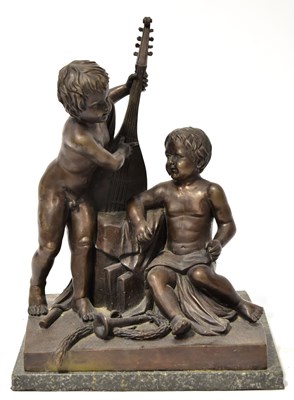 Lot 272 - A bronze figure group of two putti with...