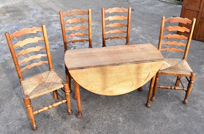 Lot 1602 - A Georgian oak oval drop-leaf gateleg table
