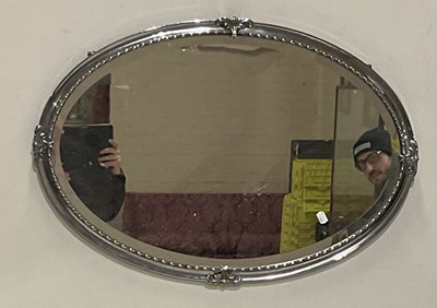Lot 2094 - An Art Deco oval wall hanging mirror, 57 x 82cm.