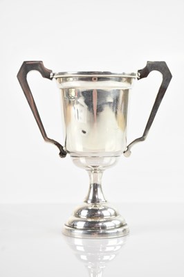 Lot 84 - A hallmarked silver twin handled trophy,...