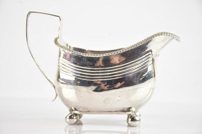 Lot 337 - A George III hallmarked silver milk jug,...