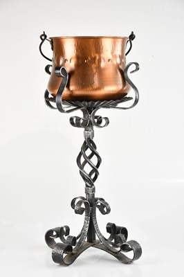 Lot 2317 - A modern copper planter on iron base, height...