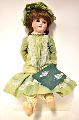 Lot 229 - SIMON & HALBIG; a bisque headed doll, with...