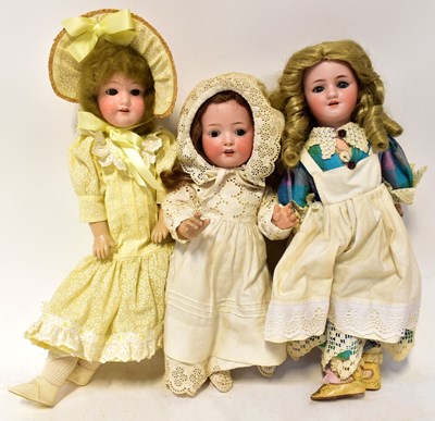 Lot 327 - Three antique bisque head dolls, comprising a...