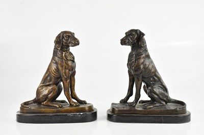 Lot 1206 - A pair of reproduction bronze models of seated...
