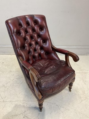 Lot 2136 - A reproduction library chair in buttoned red...